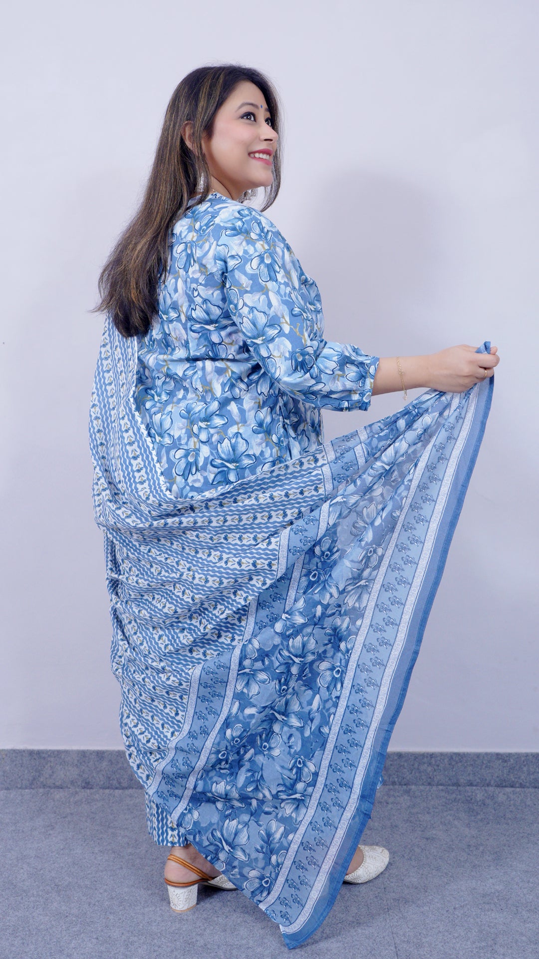 Back view of blue A-line cotton kurta set with lace detailing