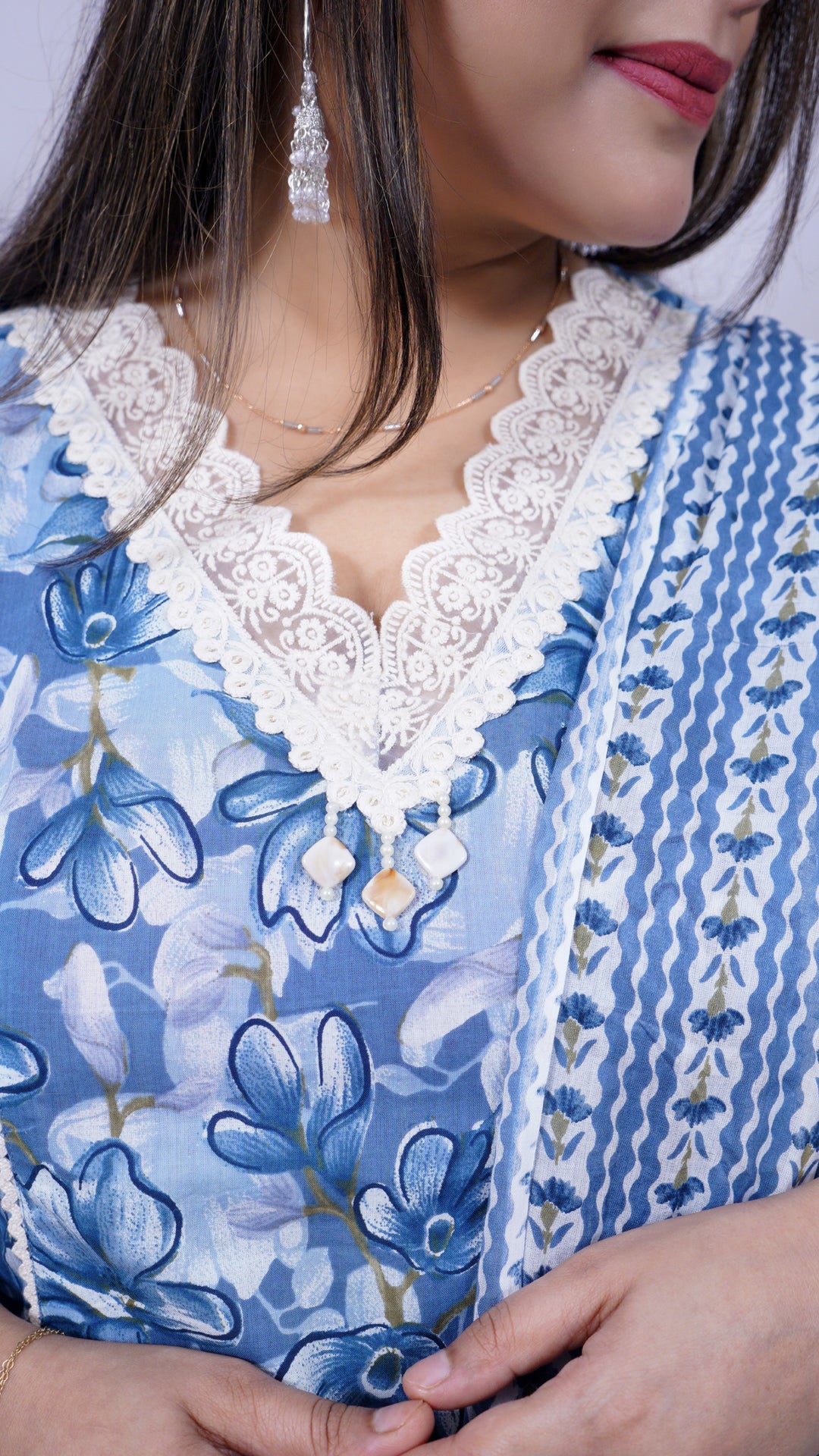 Neckline detail of blue A-line cotton kurta set with lace detailing