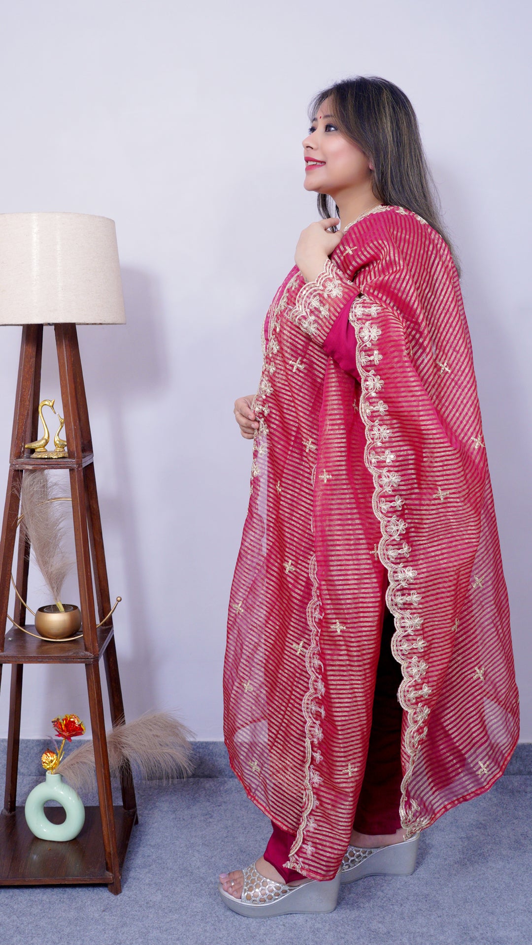 Side view of cotton silk embroidered maroon suit set – women’s festive wear