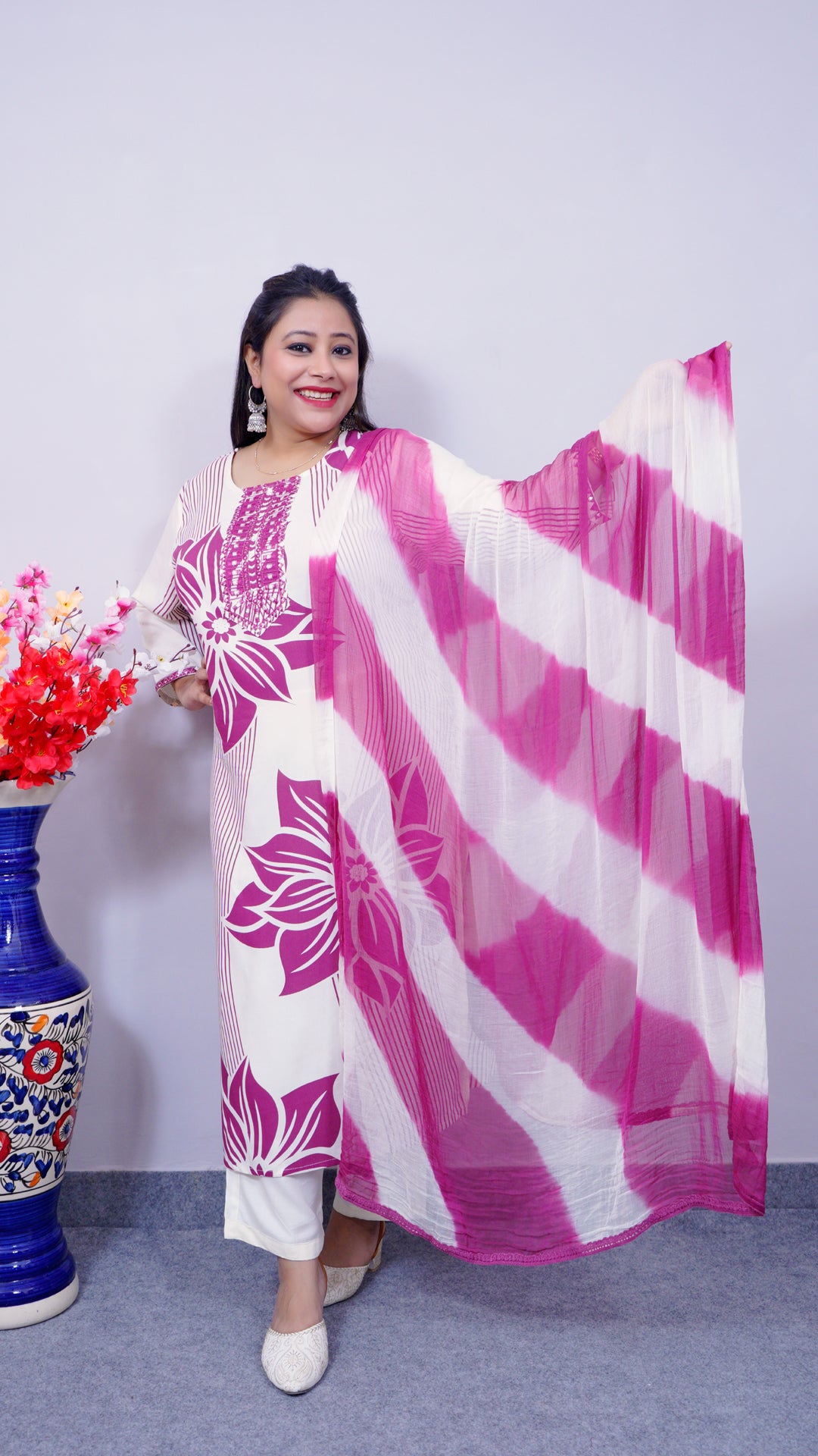 Fabric texture of white floral viscose rayon suit set – soft ethnic wear for women
