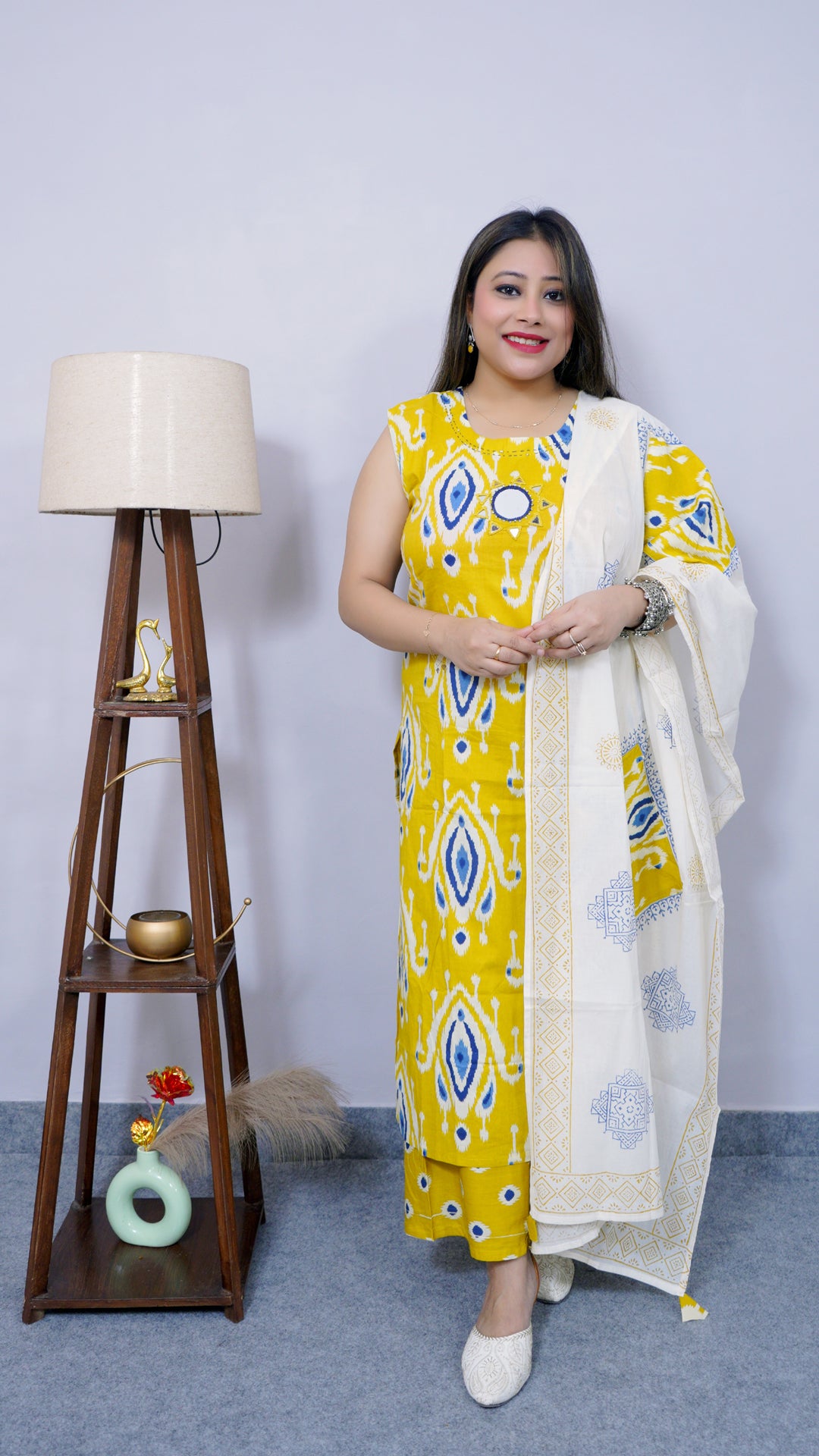 Front view of yellow-white ikat print cotton suit set for women